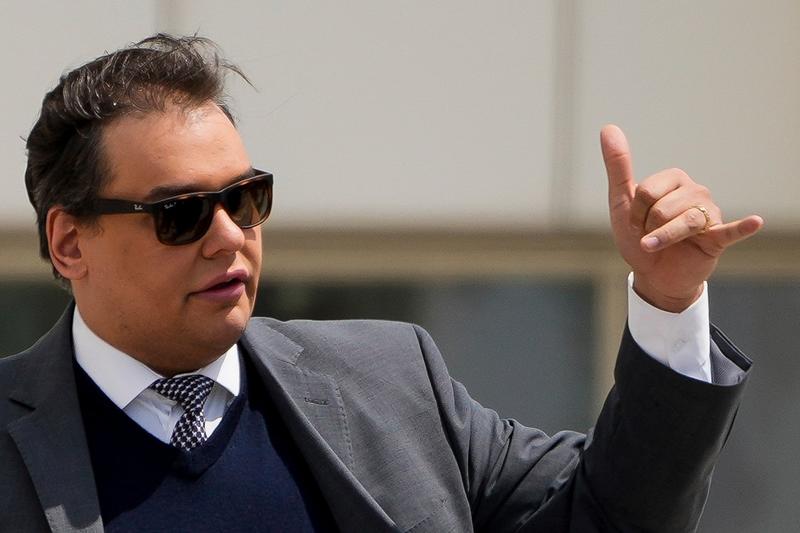 Ex-US Rep. George Santos sentenced to over 7 years in prison for fraud, identity theft