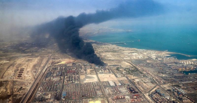 Eighteen killed, fires still burning in huge Iran port blast