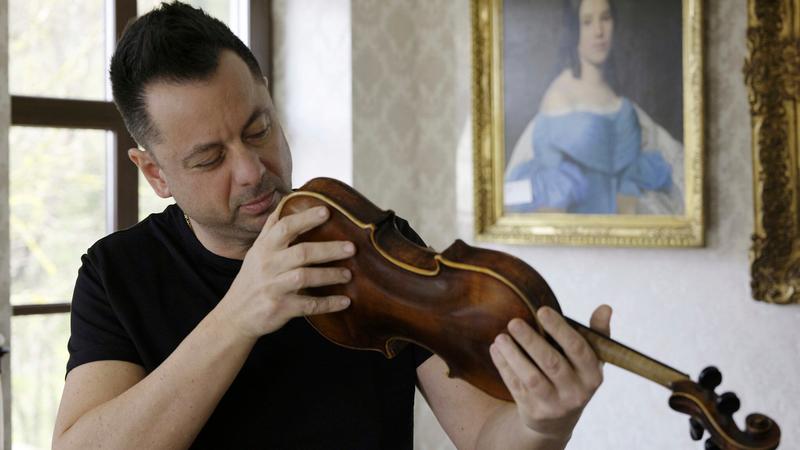 Secret note reveals origin of violin crafted by Jewish inmate inside Dachau