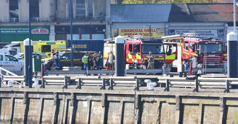 Cruiser catches fire off coast with two people on board