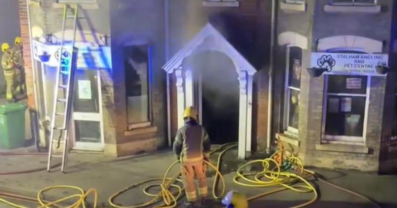 Fire crews fight blaze at town pet shop as smoke 'billows' out front door