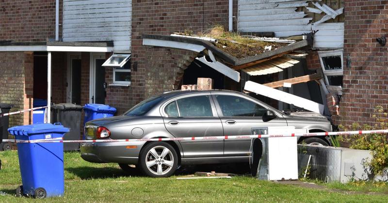 Car careers into home on housing estate