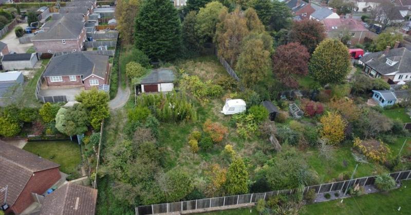 Land featuring garages sells for above estimate at auction