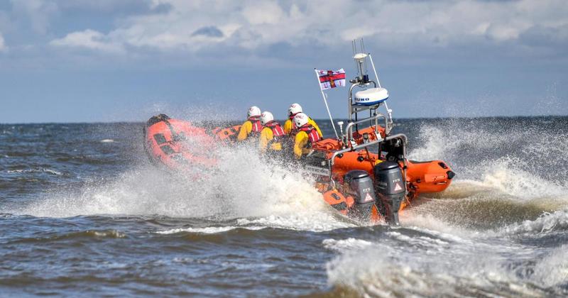 Cruiser gets stuck on sandbank with two people on board