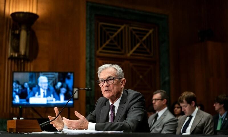 Powell urges caution on rate cuts