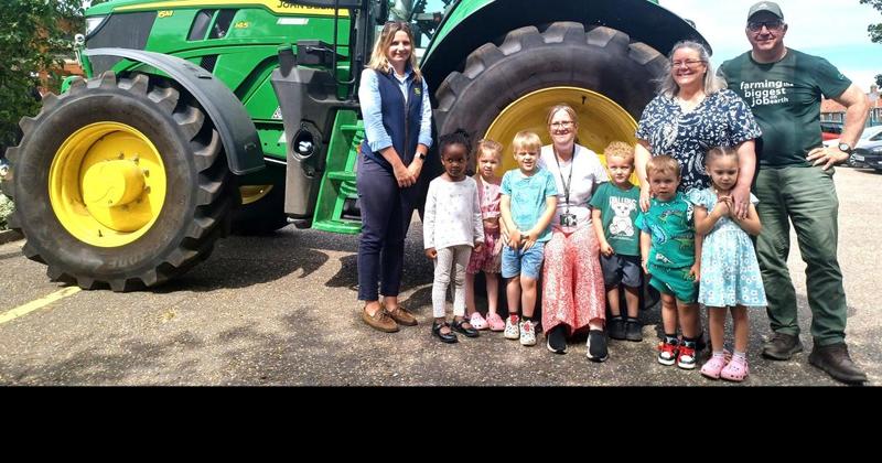City children get their first taste of farming life as tractor trundles into school