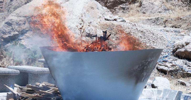 Kurdish PKK fighters destroy weapons at key ceremony