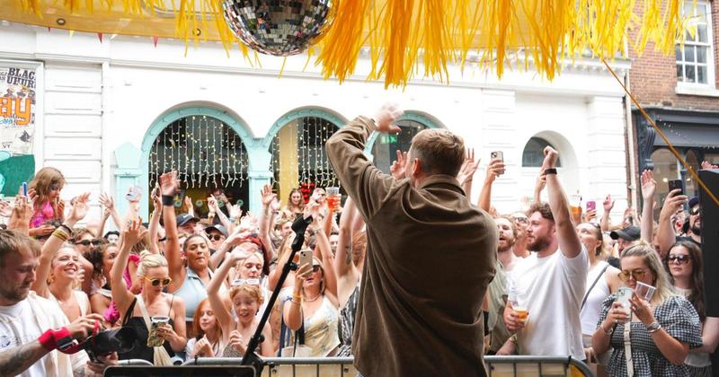 Chart-topping rapper performs outside Norwich bar in surprise gig