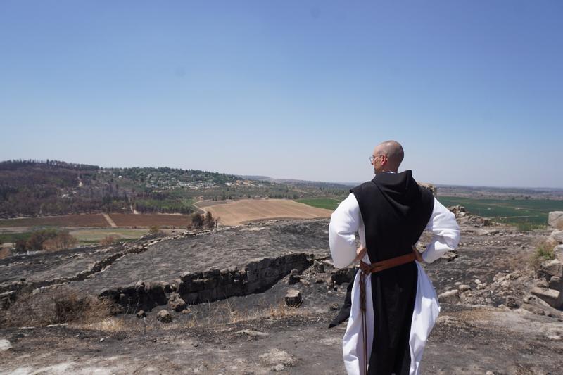 After Catholic monks’ vineyard was burned in wildfires, Israelis dig in to help replant