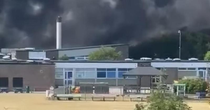 Pupils watch on as blaze rips through school roof