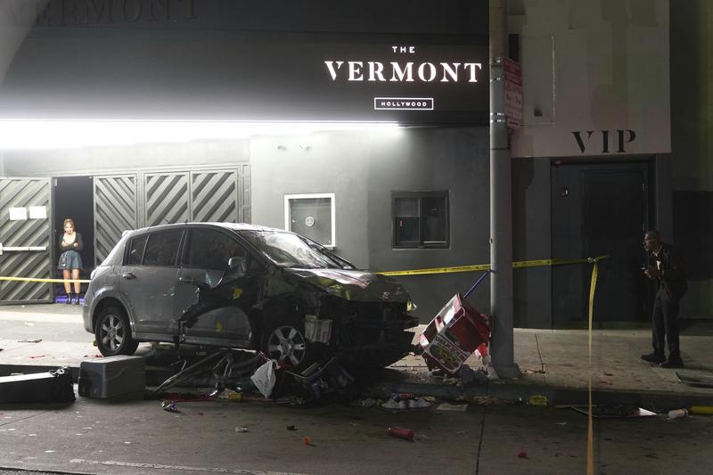 Man whose car struck crowd outside LA club, injuring 30, was shot and attacked