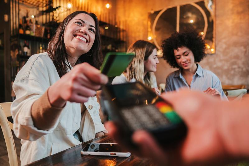 Time to ditch splitting the bill? Shouting a close friend could actually make you happier