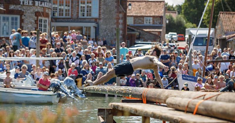 Photo gallery: Crowds gather for century-old greasy pole challenge