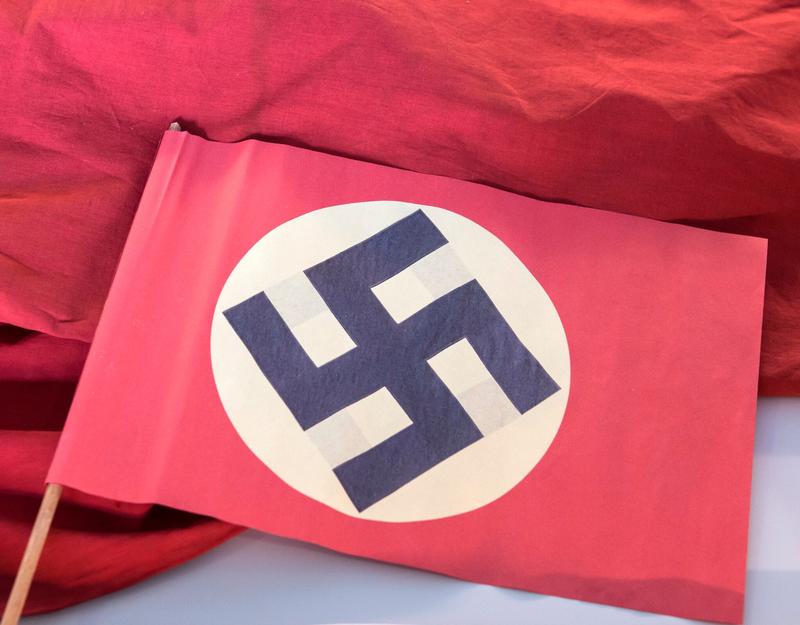 Belgian politician apologizes after compromising photo shows him draped in Nazi flag