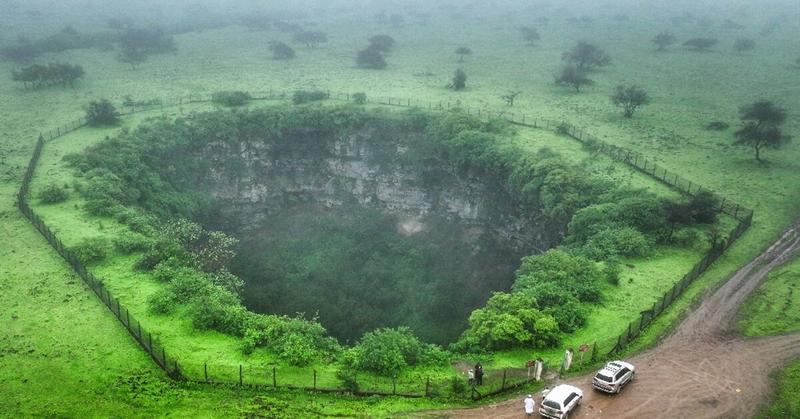 Mind the gap: tourists drawn to Oman's giant sinkholes