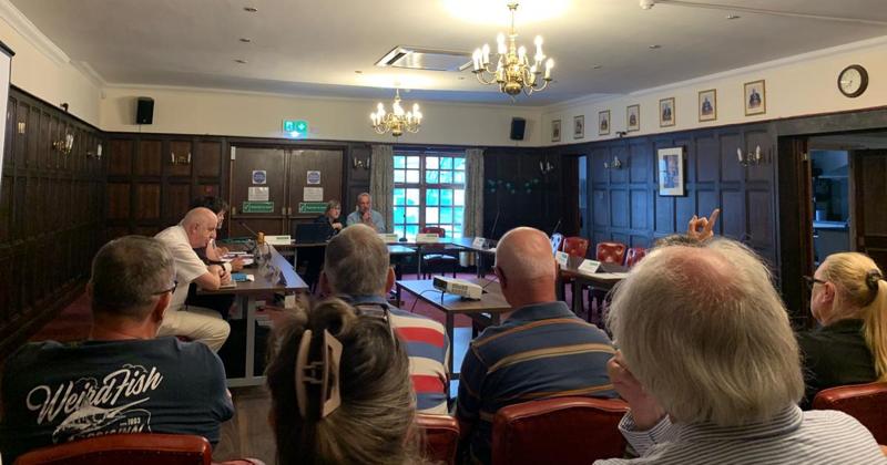 Slow hand claps in council chamber as members skip meeting over convicted colleague