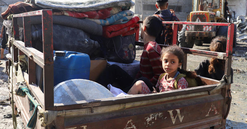 Families leave Gaza City after night of bombardment, Israelis protest