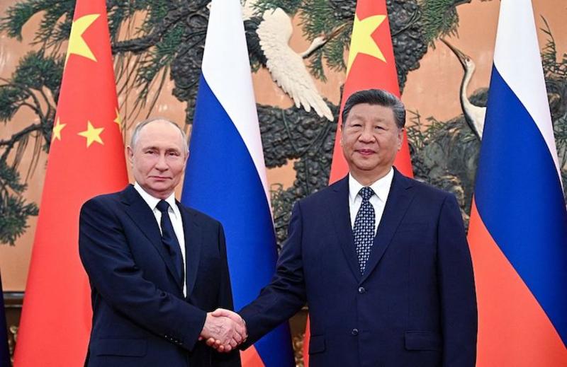 Beijing buzz /					 													 						Why is Putin so happy in China?