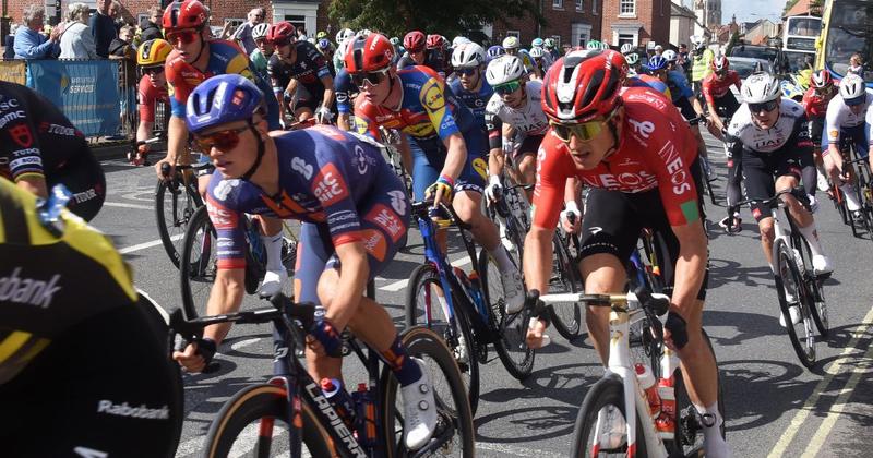 Crowds cheer as cyclists soar through the streets in country's biggest bike race
