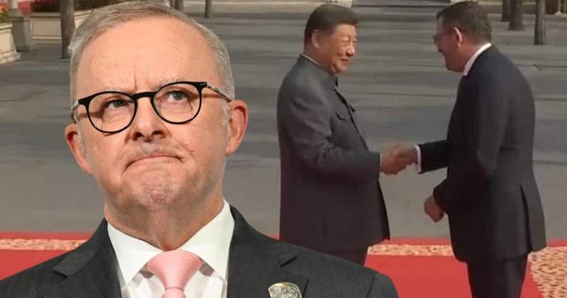 Andrews’ red-carpet walk in China puts PM on spot