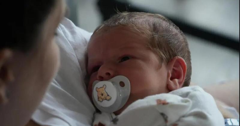 Baby makes shock arrival in football club toilets
