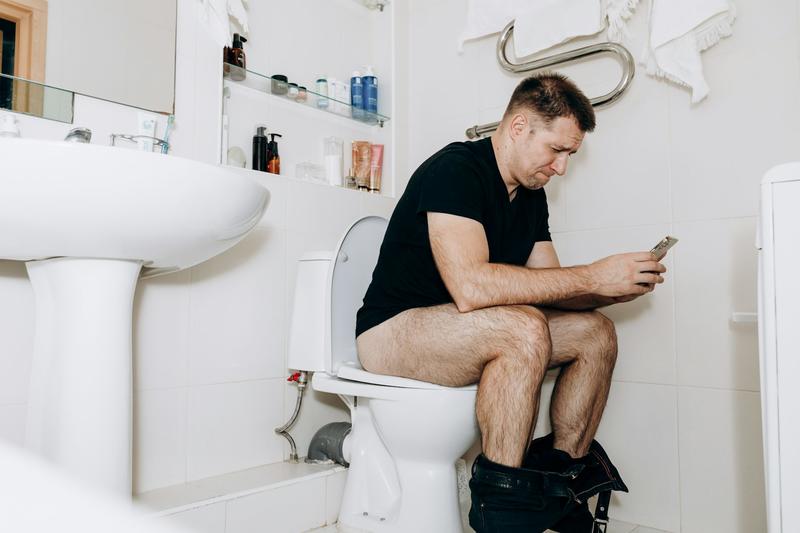 Seven health conditions that show why using your phone on the toilet is a bad idea