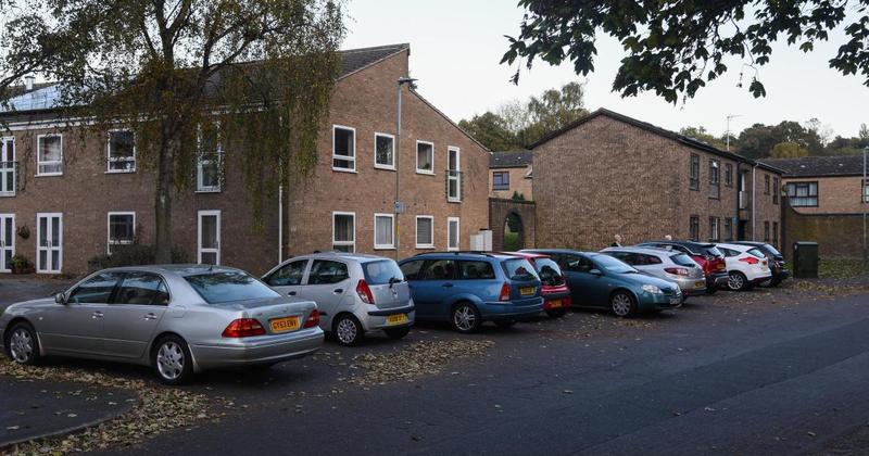 Man in 30s found dead in communal area of flats after fall from height