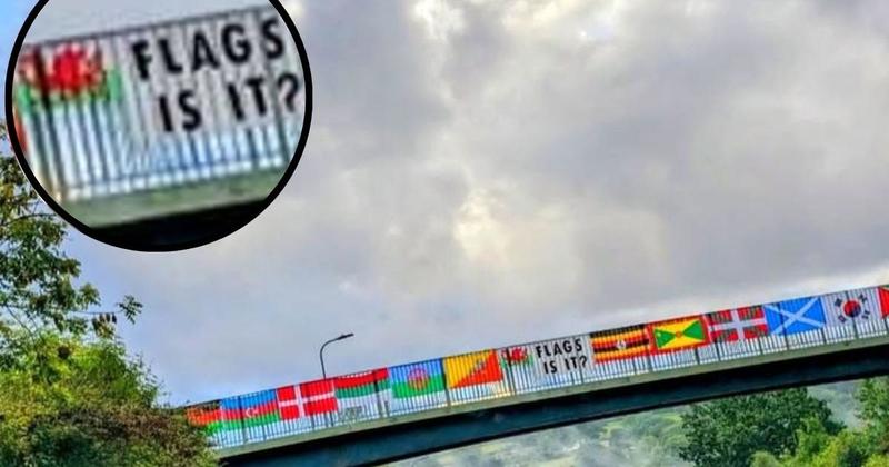'This is wonderful,' defiant locals hang a display of multicultural flags over bridge