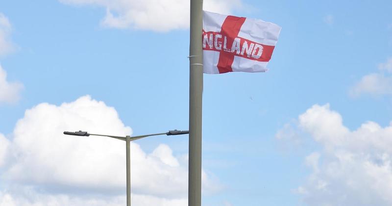 Man arrested for assault after tempers flare over flags