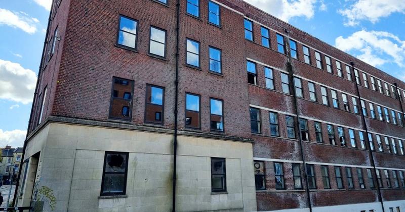 What is happening with one of the city's largest derelict buildings?