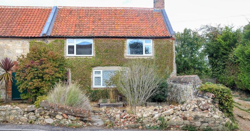 Fallen wall causing 'unsightly mess' and outrage in picturesque coastal village