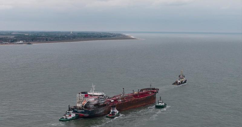 Aerial photos show damaged oil tanker being towed from Norfolk harbour