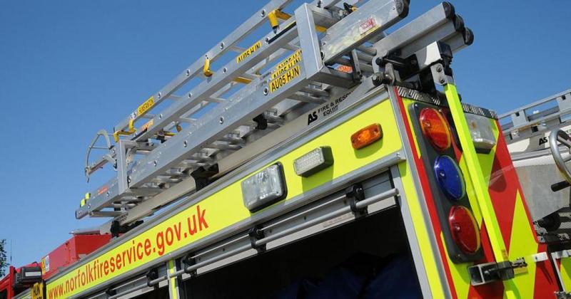 Flames rip through car near hedgerow