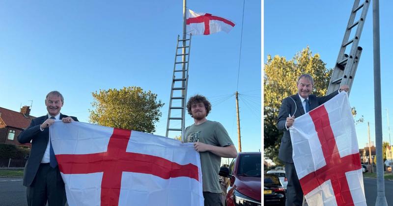 Norfolk MP joins local flaggers up ladders after spending £500 on St George's Crosses