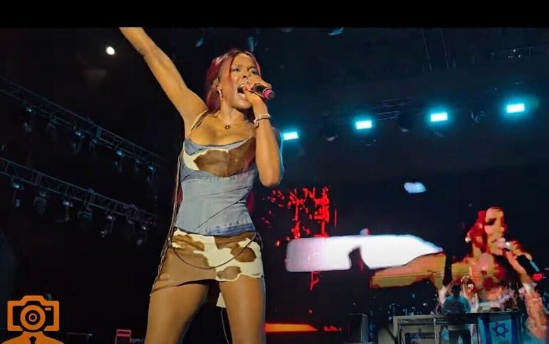 Rapper Azealia Banks performs in Tel Aviv, draped in Israeli flag