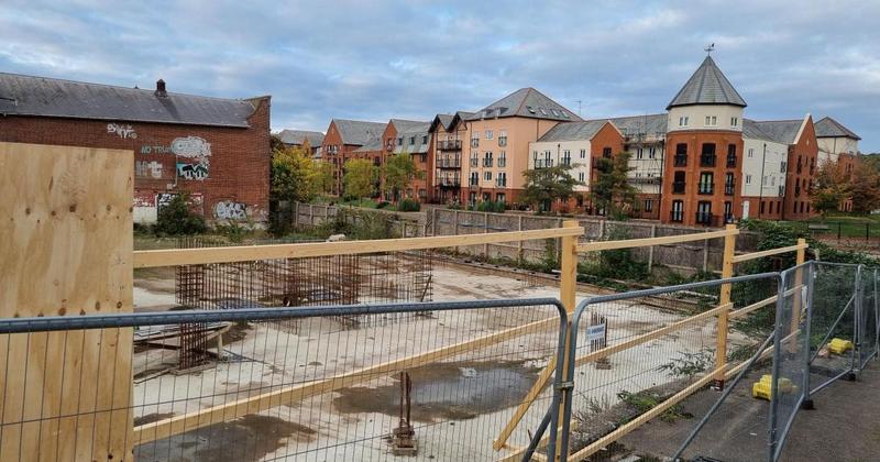 New fence spotted around empty site set for dozens of flats