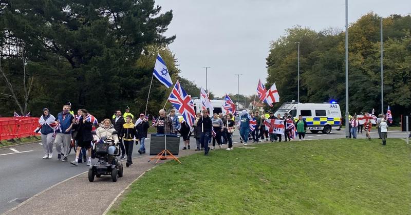 Churchill speech and Robinson chants as about 100 protesters gather at asylum hotel