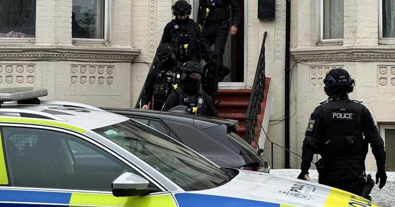 Neighbours in 'shock' as armed police storm flats after alleged crossbow fire