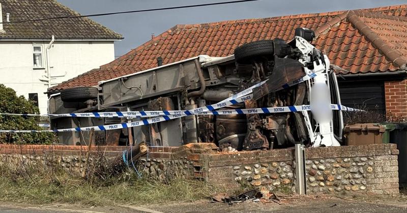 Campervan overturns into front garden
