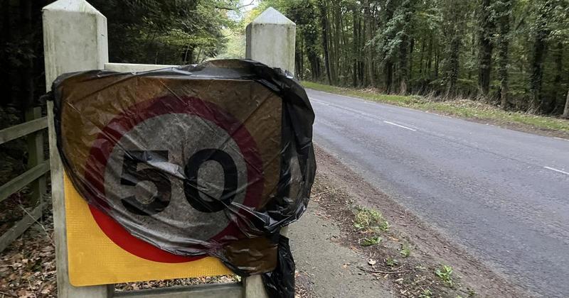 Speed limit signs draped in bin bags ahead of changes on busy A140 Speed limit signs draped in bin bags ahead of changes on busy A140