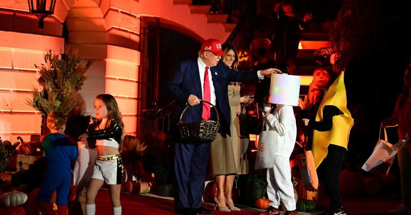Trump Plays the Hits, Puts Halloween Candy on a Kid’s Head