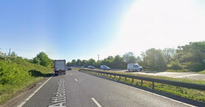Delays on A11 after crash damages central reservation