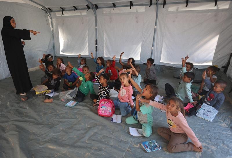 Despite Israel’s bid to shut it, UNRWA resumes teaching in Gaza as kids hit books amid rubble