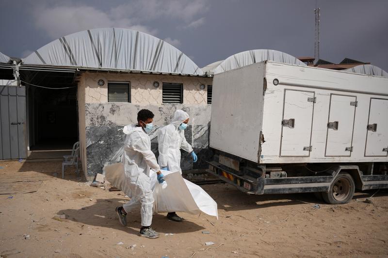 Israel returns 15 Palestinian bodies to Gaza, where displaced families endure winter rains