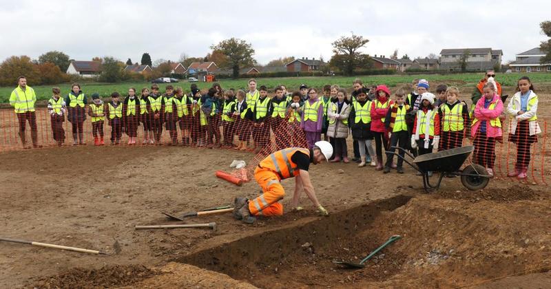 School children get hands-on at live archaeological dig
