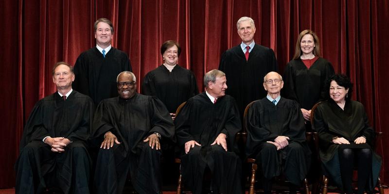 Nine Justices in Black Who Rule White