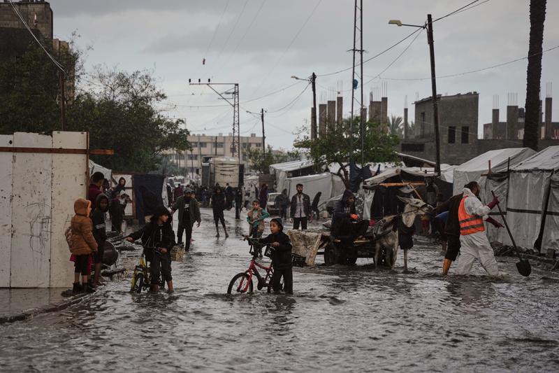 ‘Everything is soaked’: Rain floods Gaza tents, amid efforts to ramp up aid