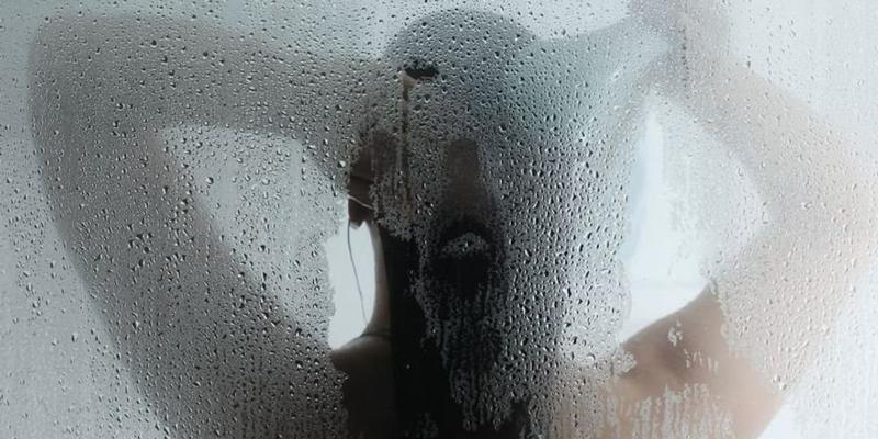 A dad's steamy shower door photo represents a sweet recognition of his wife's work