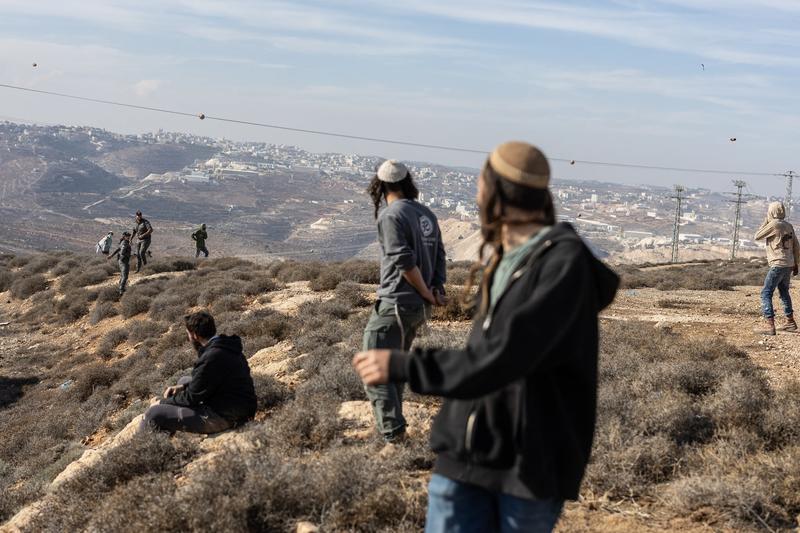 Dozens of masked Israelis riot, hurl stones after illegal West Bank outpost evacuated Dozens of masked Israelis riot, hurl stones after illegal West Bank outpost evacuated