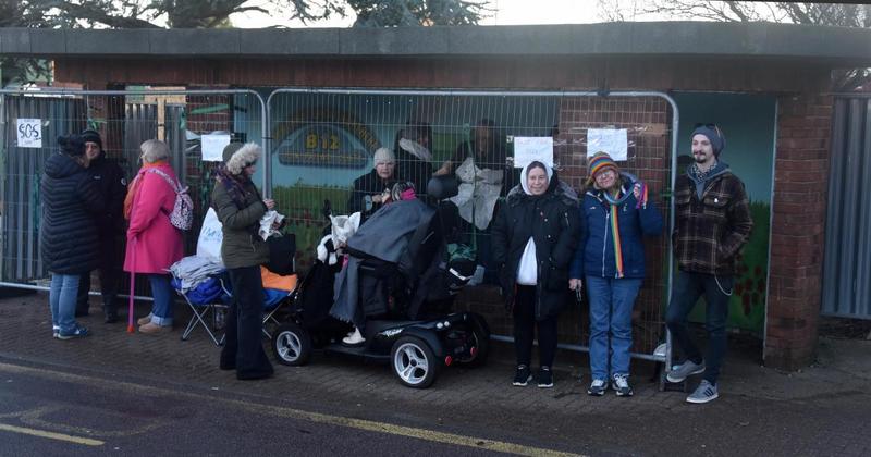 Council digs its heels in over bus shelter and orders protesters to move on